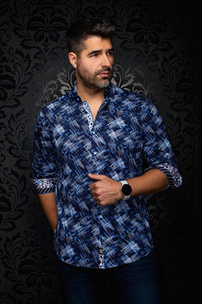 Men's angled front view of a navy patterned shirt with contrast cuff facing and rolled cuffs by Au Noir