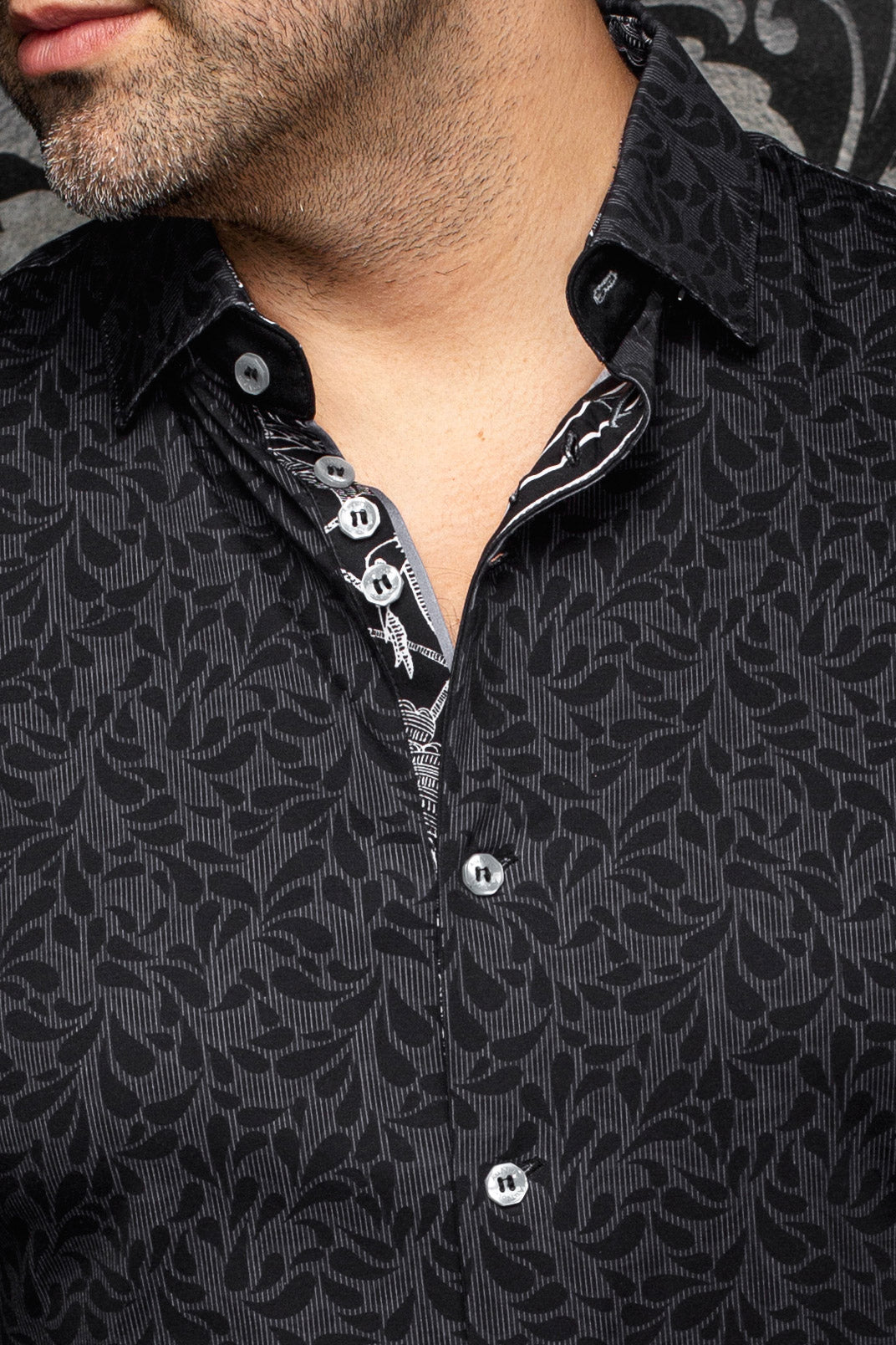 Close-up of men's black tonal floral button-up shirt collar, contrast print, light buttons and placket by Au Noir