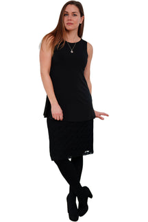 Rien ne se perd, tout se crée women's black textured lace knee-length skirt, worn with a black sleeveless top, front view