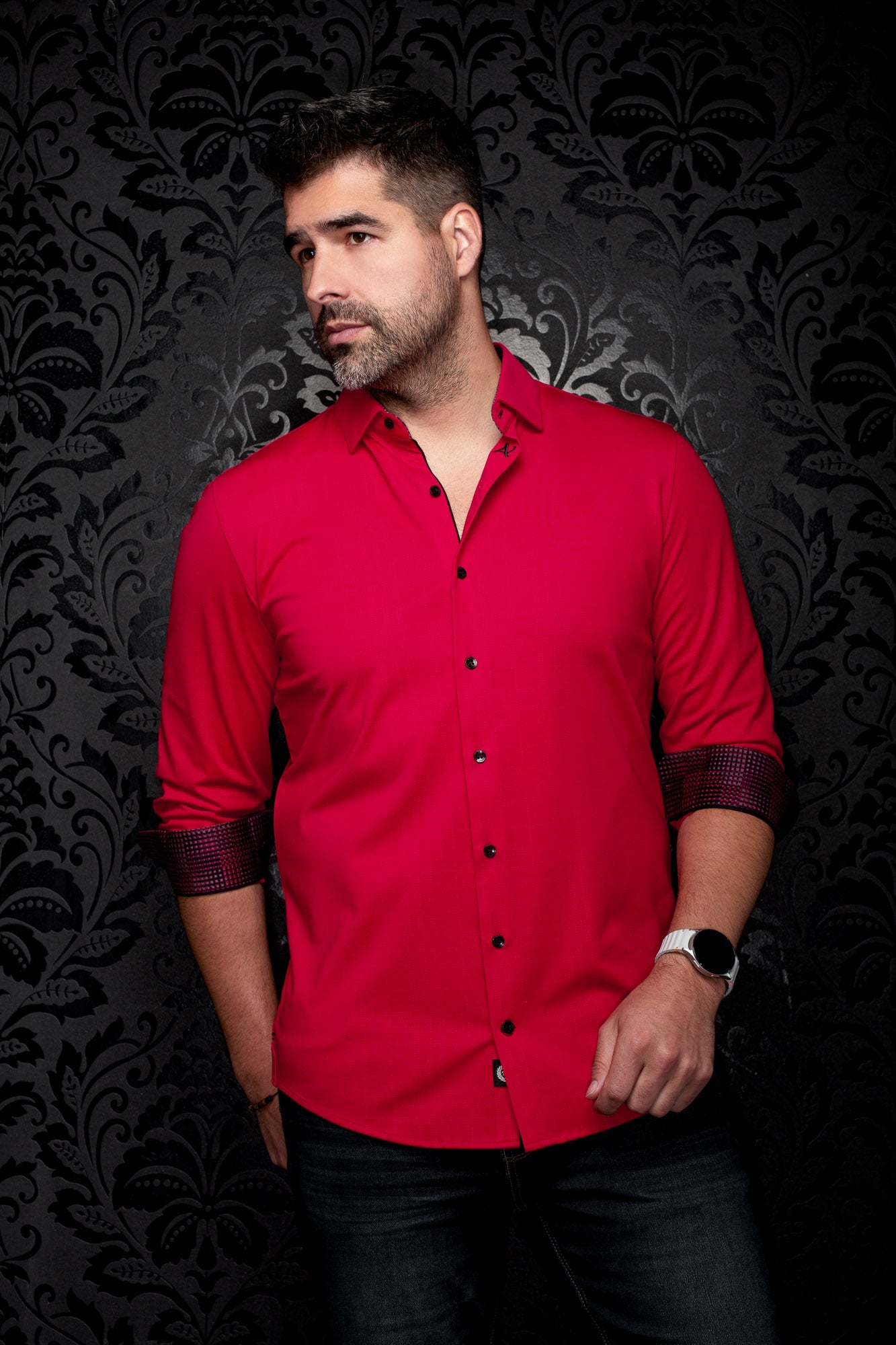 Au Noir men's red long sleeve button-up shirt on model, front angled view with rolled contrast check cuffs, side view