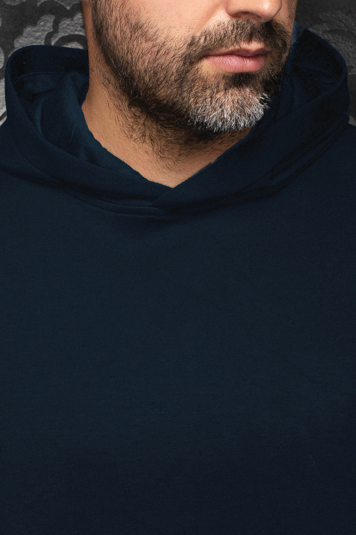 Au Noir men's navy pullover sports jacket shown close-up with smooth plain front and hooded neckline