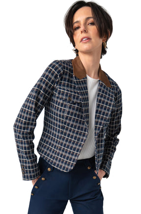 Women's angled front view of navy plaid blazer with brown contrast collar and button cuffs on model by Liverpool