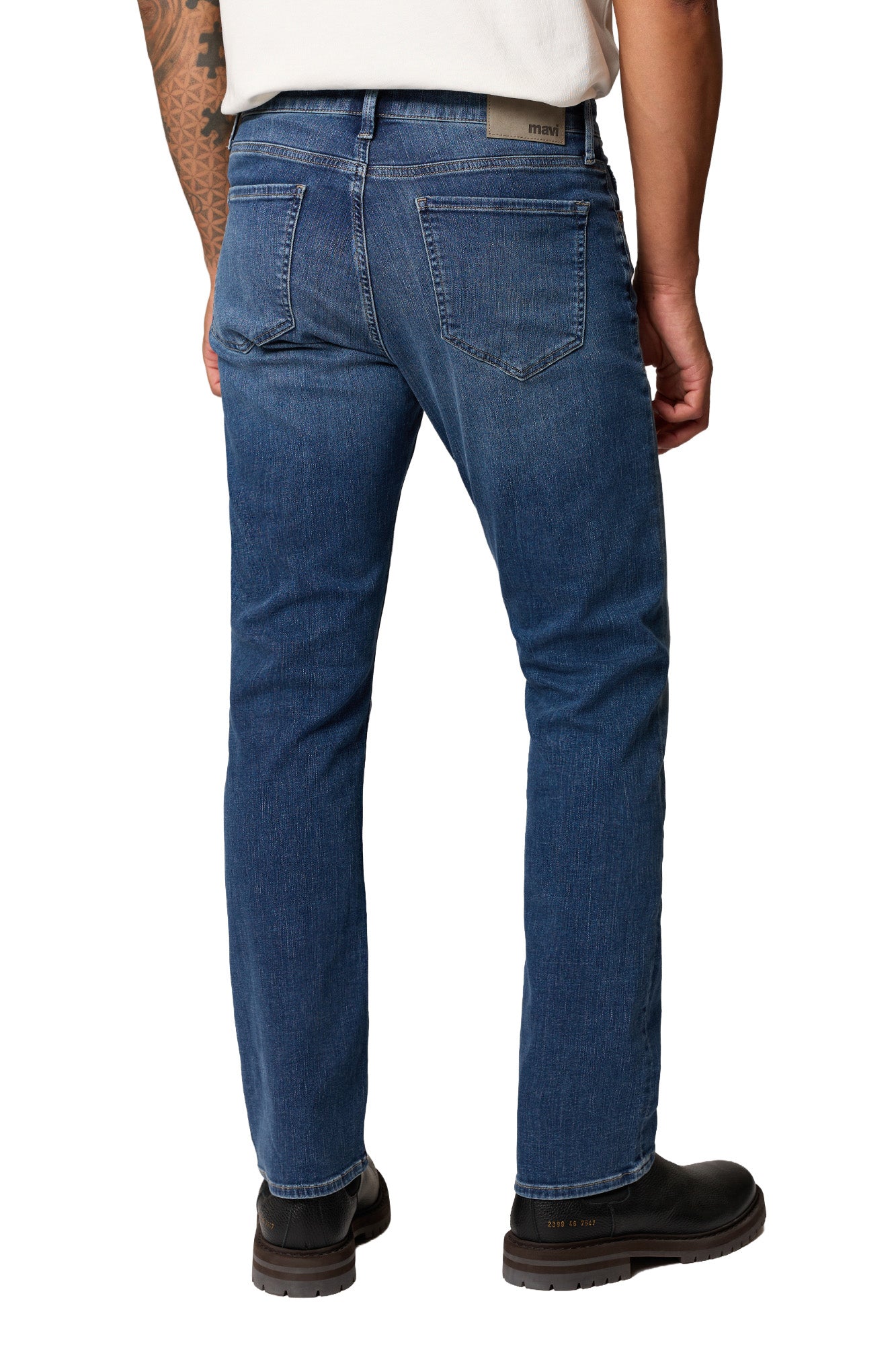 Men's medium blue straight-leg jeans back view with patch pockets, waistband logo patch and straight hems by Mavi Jeans