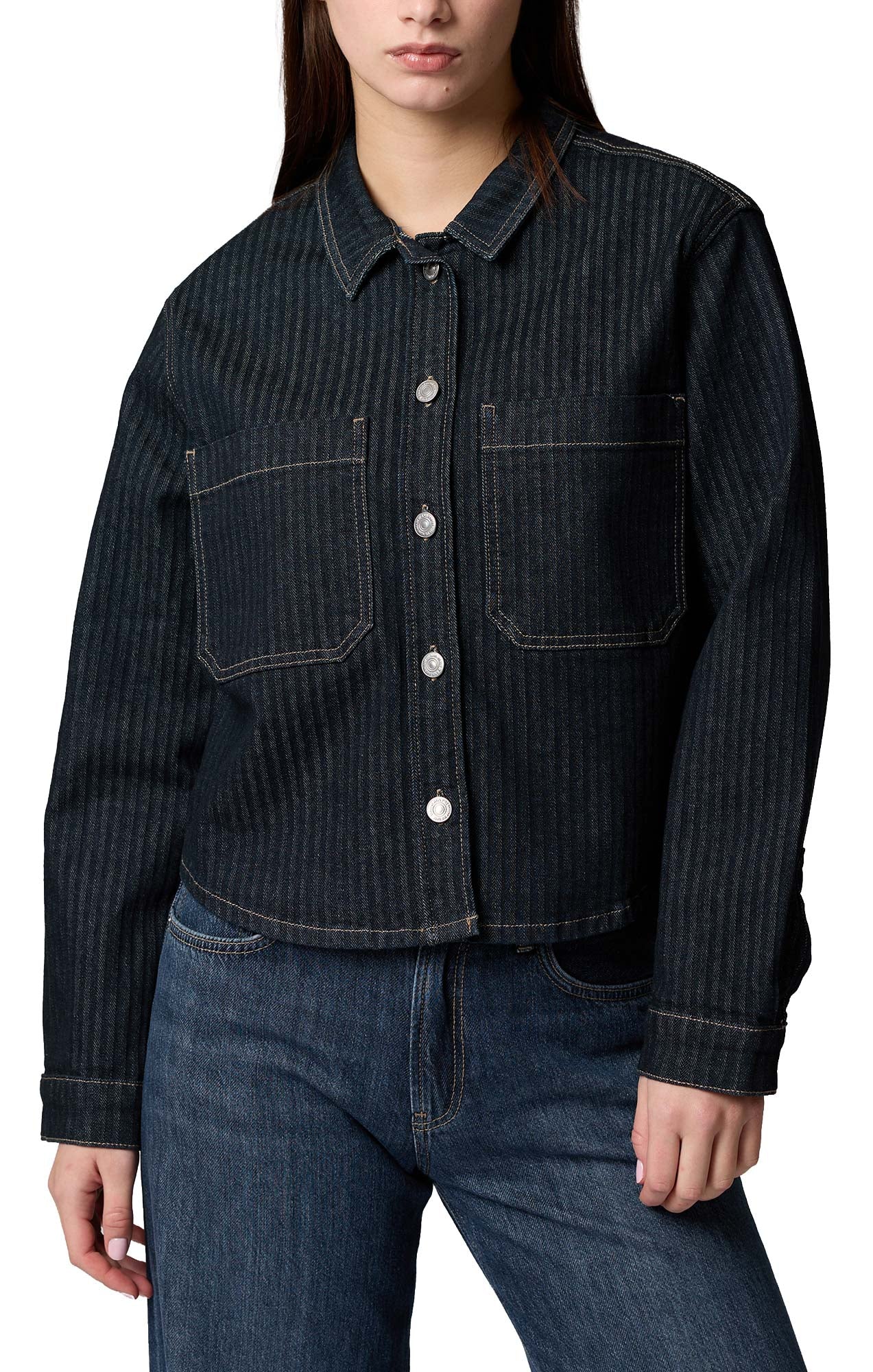 Women's dark indigo denim long-sleeve blouse front view with collar, metal buttons, and two chest pockets by Mavi Jeans