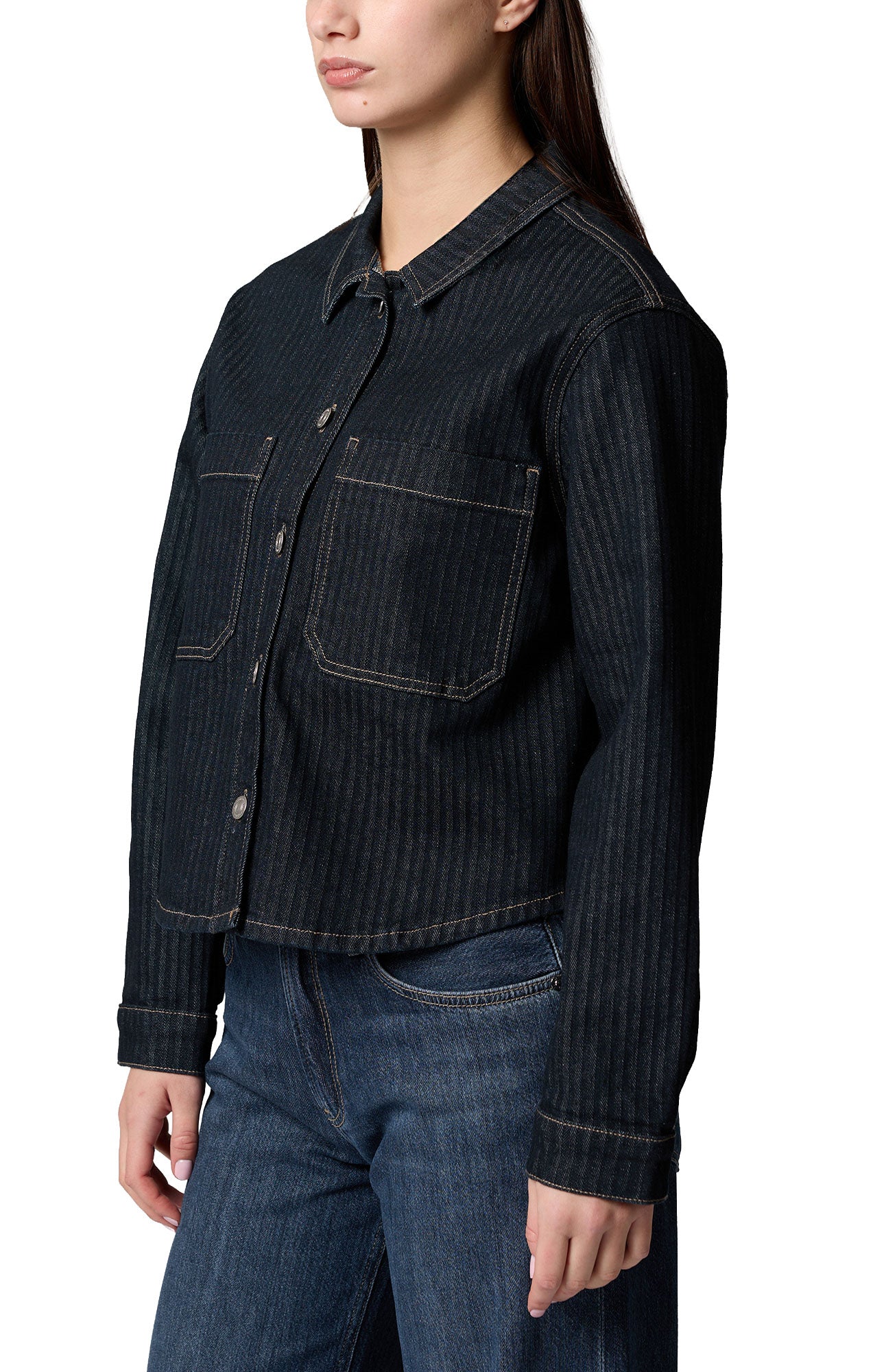 Women's angled view of dark indigo denim long-sleeve blouse showing collar and chest pockets, side view by Mavi Jeans
