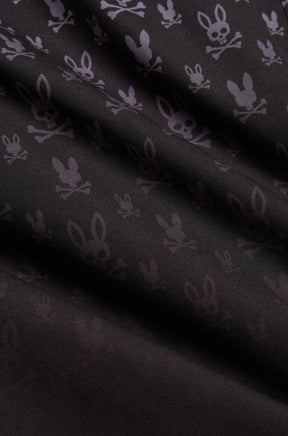 Short maillot noir à motif lapin tête de mort gris foncé et texture tissée lisse pour homme par Psycho Bunny, en gros plan