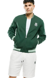 Psycho Bunny men's dark green zip bomber jacket with striped rib trims and bunny chest patch, front model view