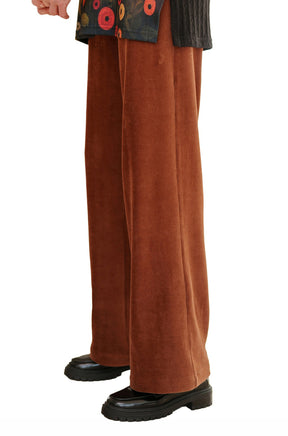 Rien ne se perd, tout se crée women's rust brown corduroy wide-leg pants showing straight leg and ribbed texture, side view