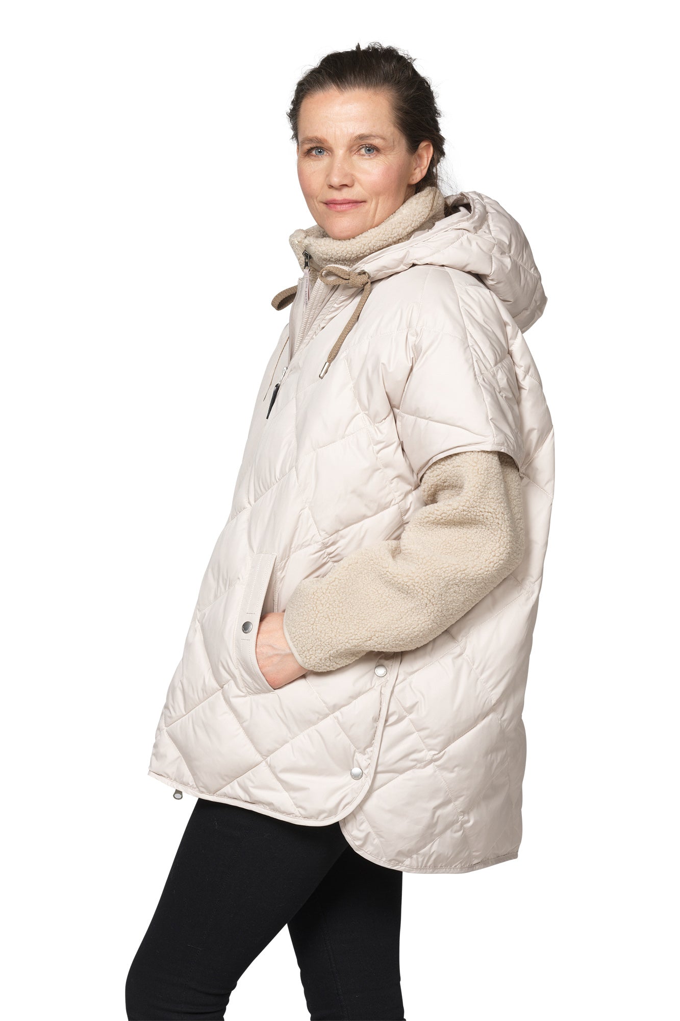 Ilse Jacobsen women's ivory quilted hooded vest with front pocket and rounded hem, side model view