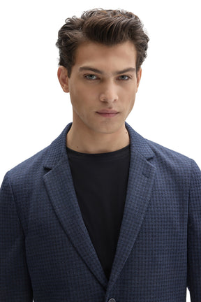 Men's close front detail of navy textured sport blazer showing notched lapels and subtle check texture by Robert Barakett