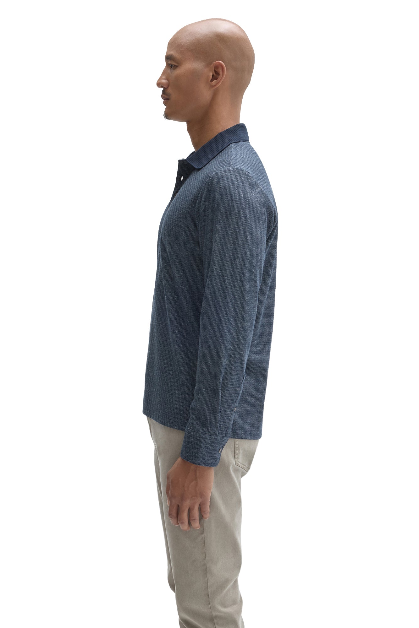 Robert Barakett men's blue textured long sleeve polo with dark ribbed collar and button cuff shown from the side