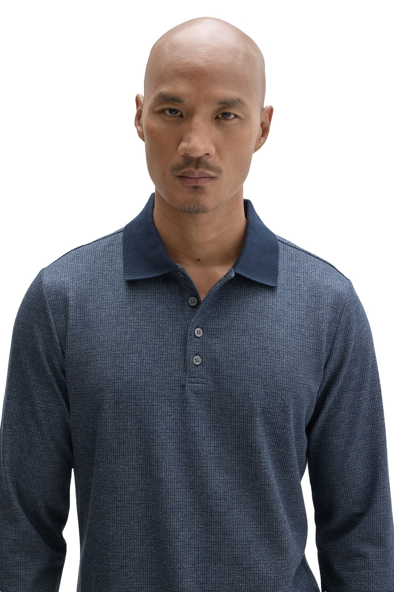 Men's close front detail of blue textured long sleeve polo with dark ribbed collar and gray buttons by Robert Barakett