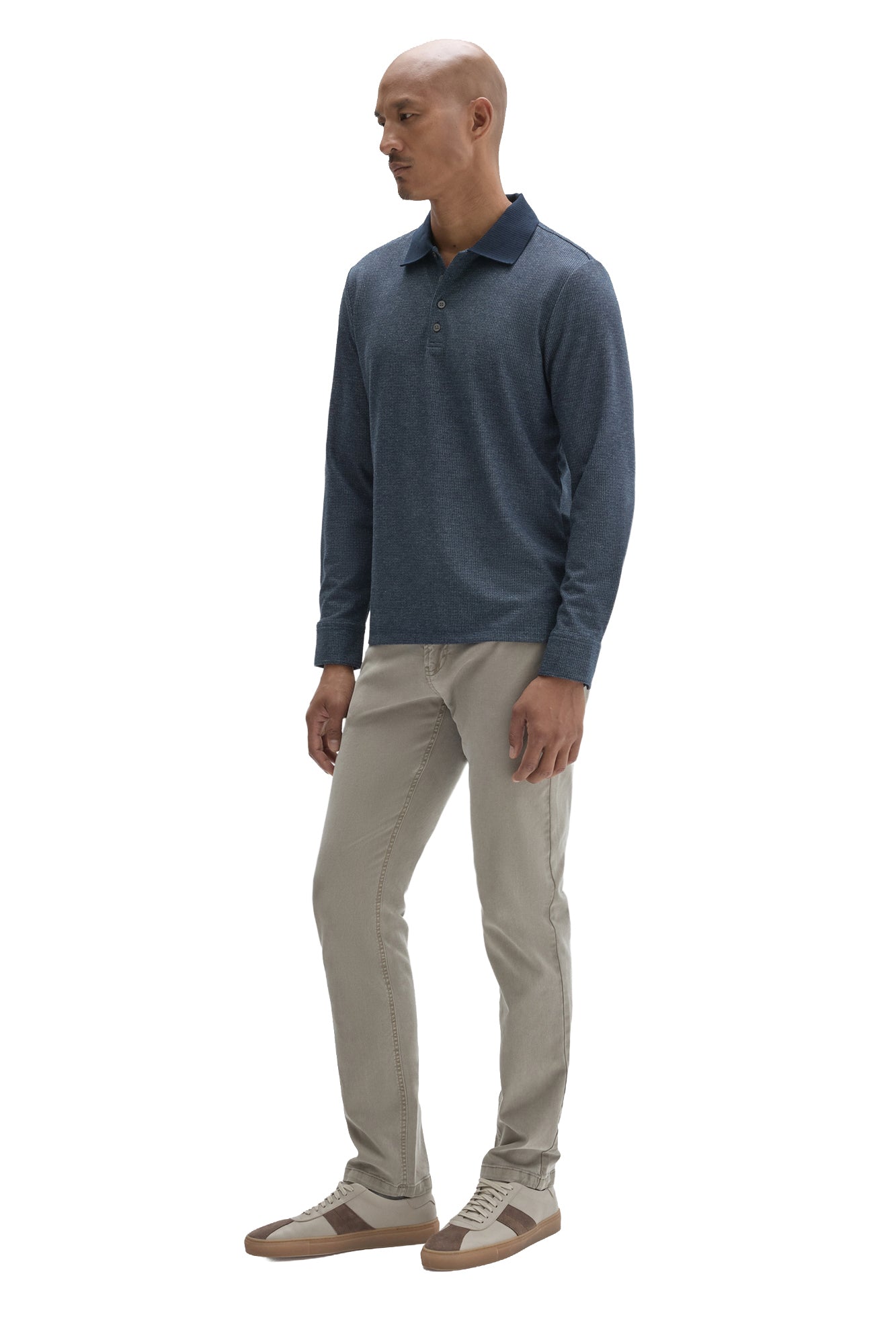 Men's angled front view of blue textured long sleeve polo with dark collar and straight hem by Robert Barakett