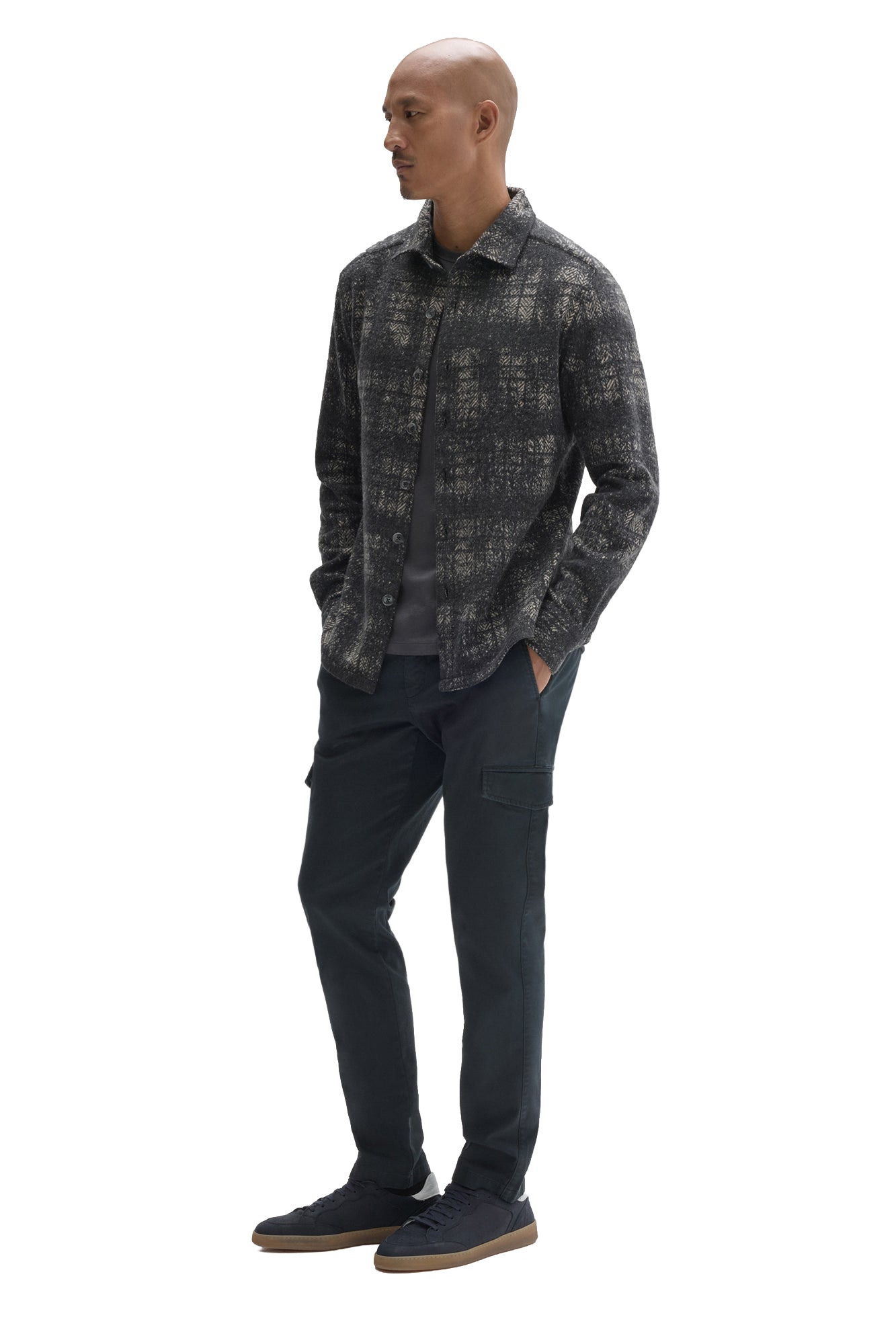 Robert Barakett men's angled full-body view of charcoal plaid overshirt worn open over a dark T-Shirt, side view