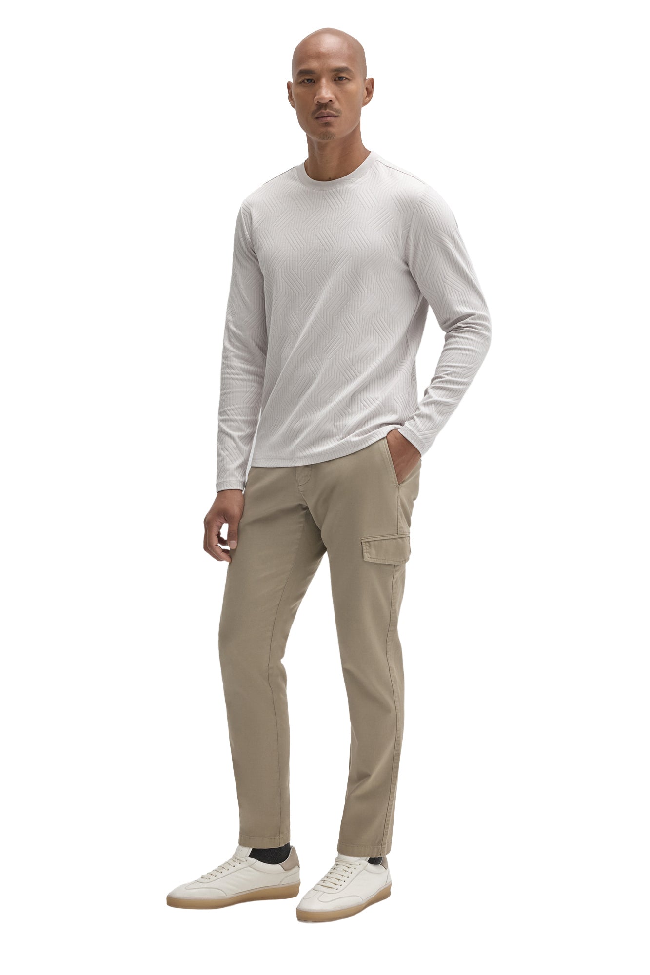 Men's angled full-body view of a light gray textured long sleeve crew neck T-Shirt, front model view by Robert Barakett
