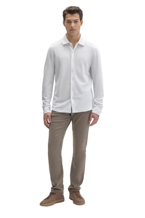 Men's full front view of white long sleeve knit button-front shirt styled with taupe pants by Robert Barakett