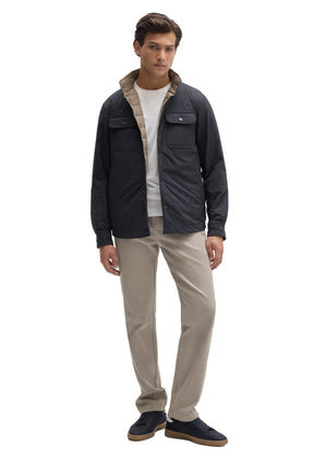 Robert Barakett men's full front view of navy reversible snap jacket worn open with taupe quilted lining visible