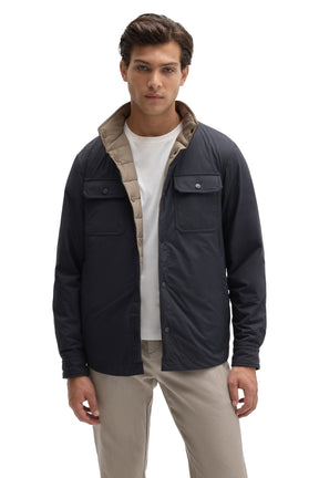 Robert Barakett men's navy snap jacket worn open to show taupe quilted reversible interior shown from the front
