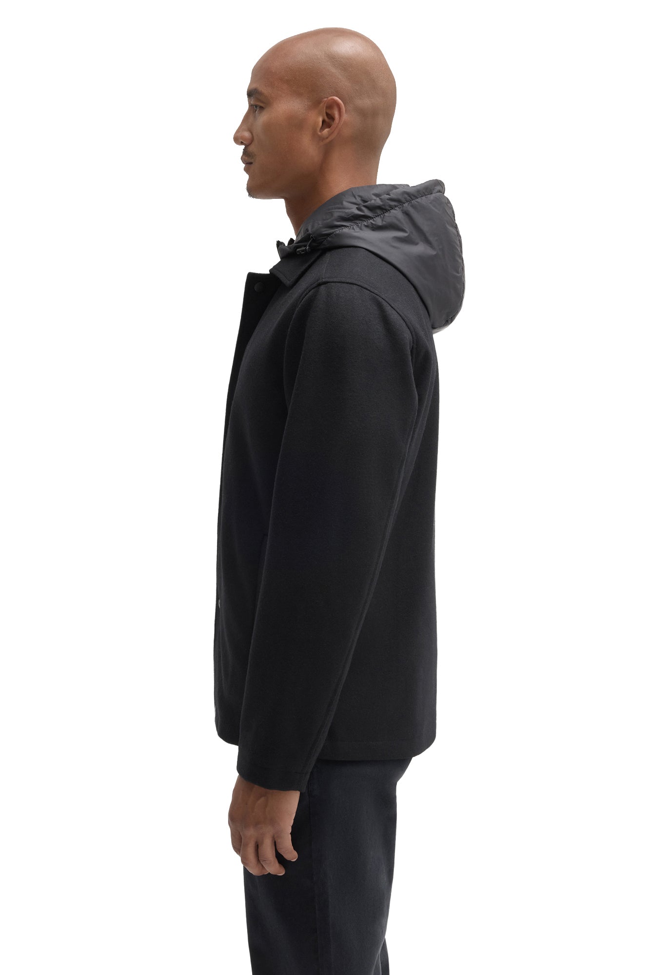 Robert Barakett men's black hooded jacket showing straight sleeve, snap placket edge, and raised hood, side view