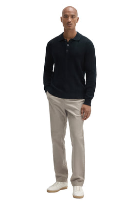 Men's full front view of a dark navy long sleeve knit polo with collar and ribbed hem by Robert Barakett