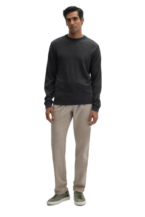 Men's full front view of a charcoal crewneck knit long-sleeve knit sweater with ribbed hem by Robert Barakett