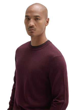 Robert Barakett men's angled close view of a burgundy crew neck long-sleeve sweater showing fine knit and dark neckline trim