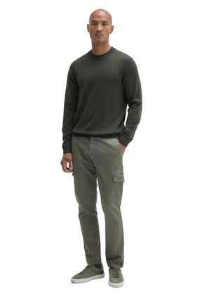 Robert Barakett men's full-body front view of a dark olive crew neck long-sleeve sweater styled with cargo pants