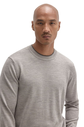 Men's close front view of a light grey crew neck long-sleeve knit sweater showing ribbed collar by Robert Barakett