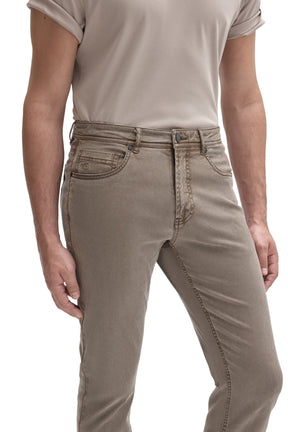 Men's close front detail of taupe gray straight-leg jeans with button fly area and coin pocket by Robert Barakett