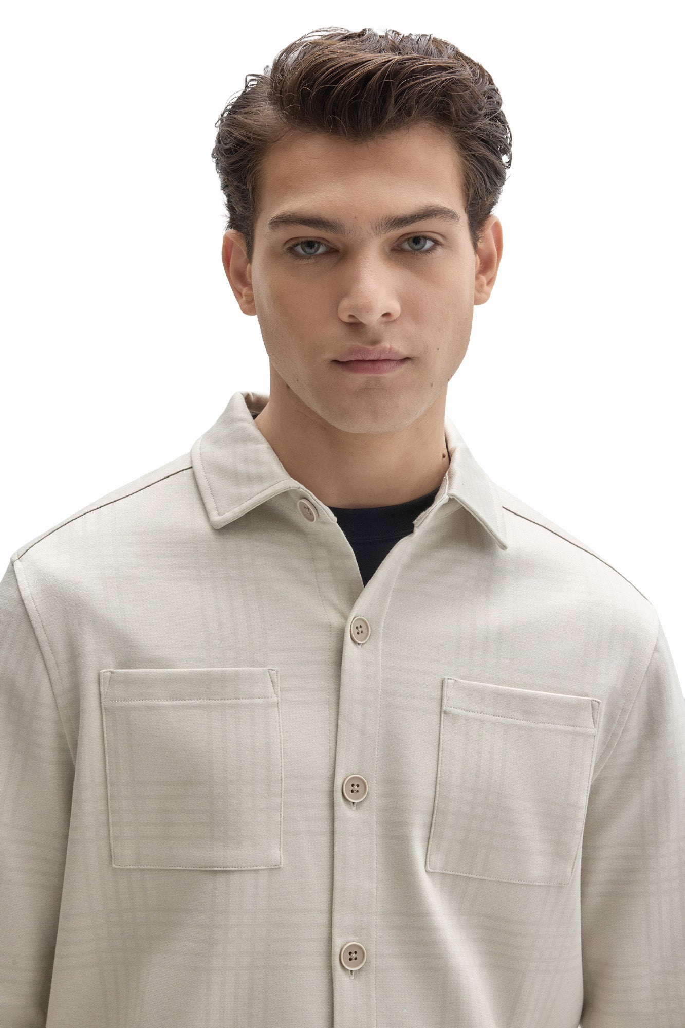 Men's front close-up of cream tonal plaid overshirt with point collar, buttons and chest patch pockets by Robert Barakett