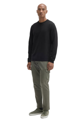 Robert Barakett men's full-body angled view of black long sleeve crew neck T-Shirt styled, front model view