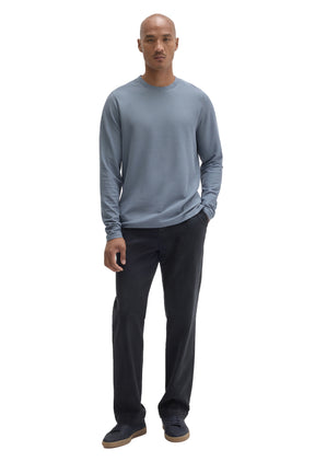 Robert Barakett men's full-length front view of blue-gray long sleeve crewneck T-Shirt styled with dark pants