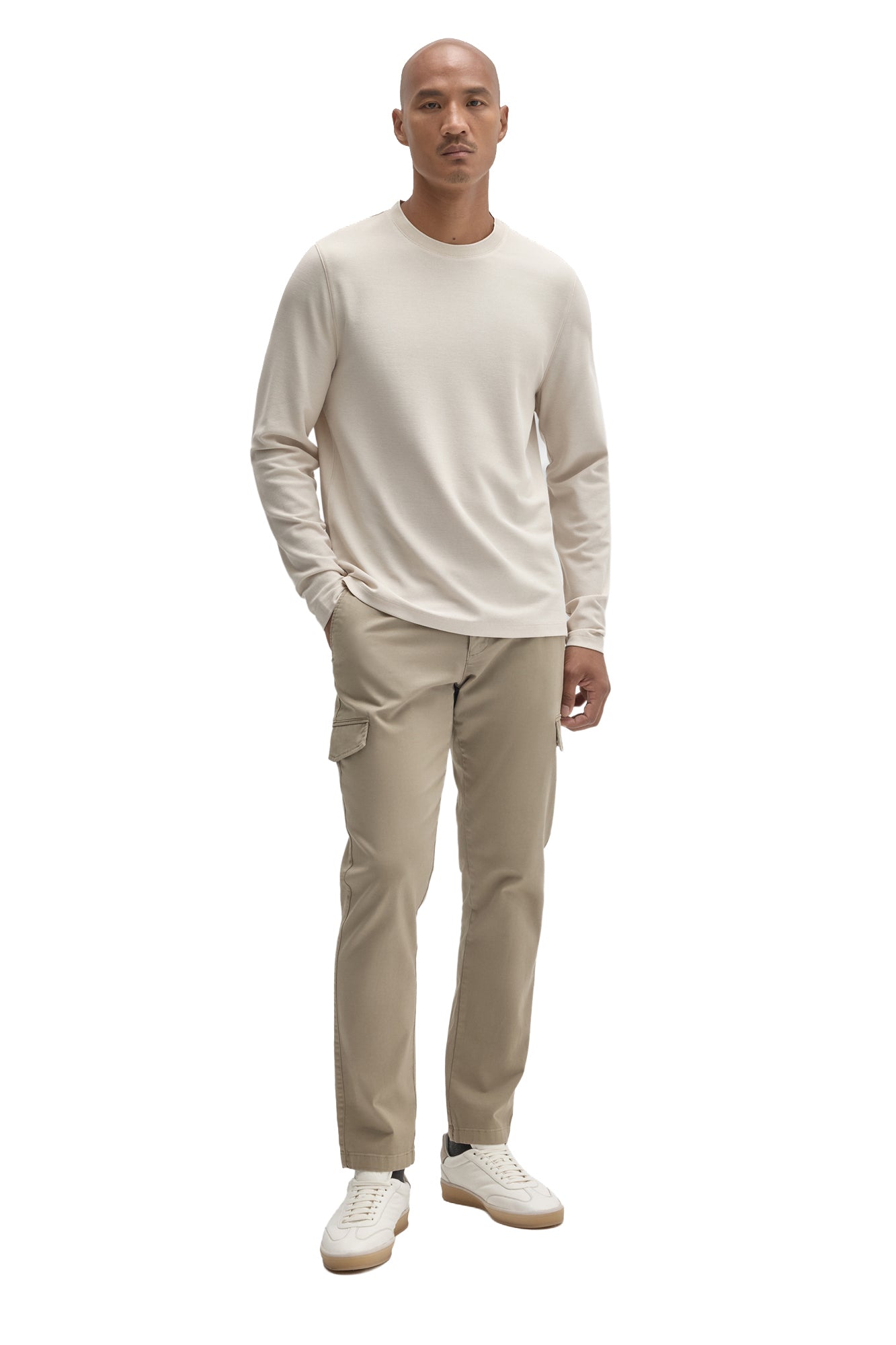 Men's full-body front view of an ivory long sleeve crewneck T-Shirt styled with beige pants by Robert Barakett