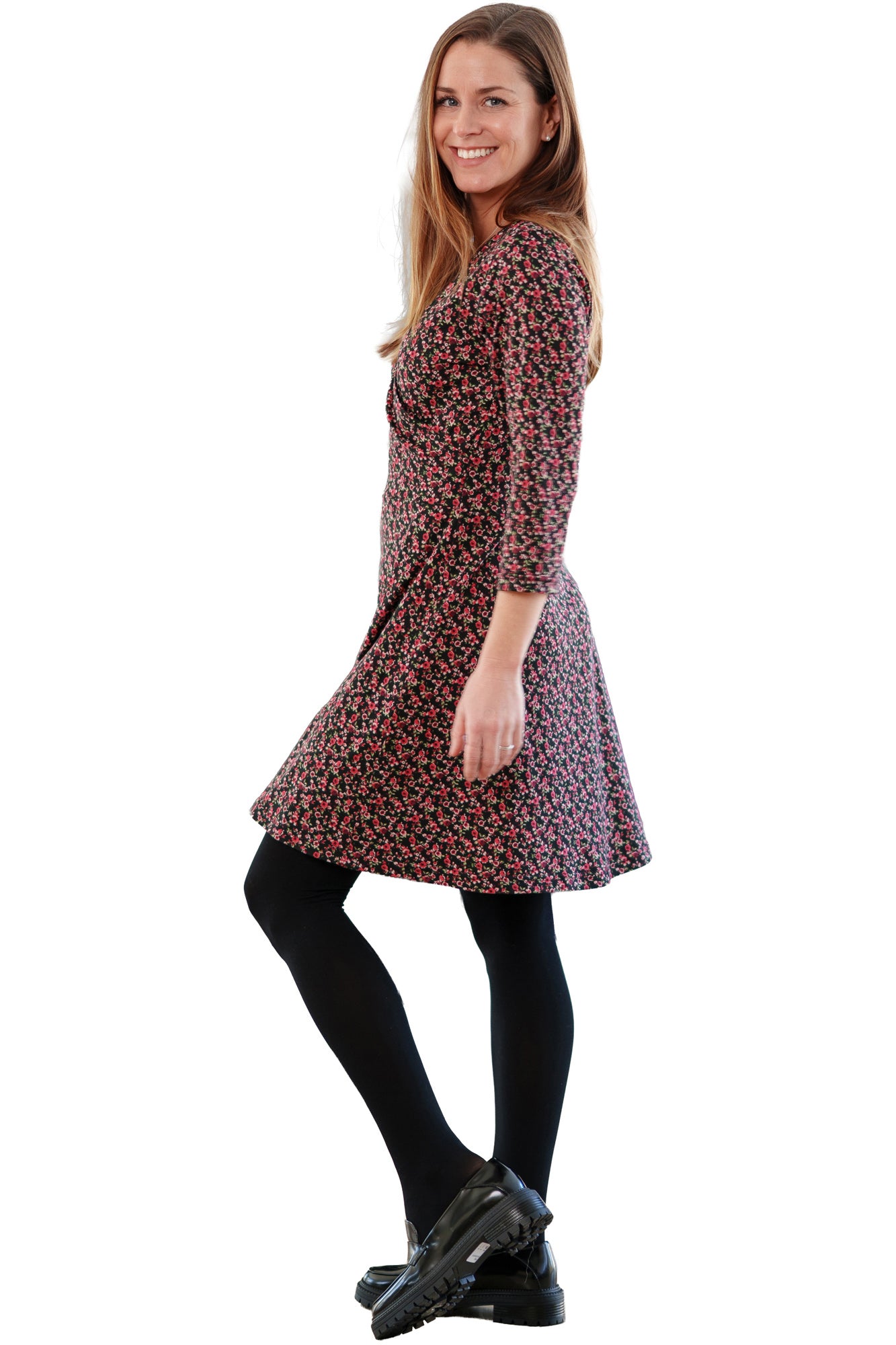 Rien ne se perd, tout se crée women's black floral dress shown from the side, with three-quarter sleeves and a flared skirt