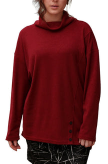 Rien ne se perd, tout se crée women's deep red cowl neck tunic with long sleeves and black side buttons shown from the front
