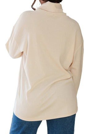 Rien ne se perd, tout se crée women's cream long sleeve tunic with cowl neck, dropped shoulders, and straight hem, back view