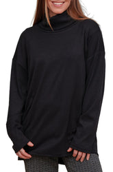Rien ne se perd, tout se crée women's black turtleneck tunic with loose long sleeves and buttons near the hem, front view