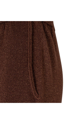 Women's detail of brown copper metallic drawstring wide-leg pants showing sparkly knit texture and side seam by Esqualo