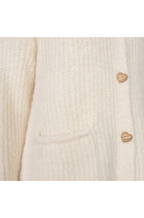 Women's detail of cream fuzzy knit cardigan with gold heart buttons and a front patch pocket by Esqualo