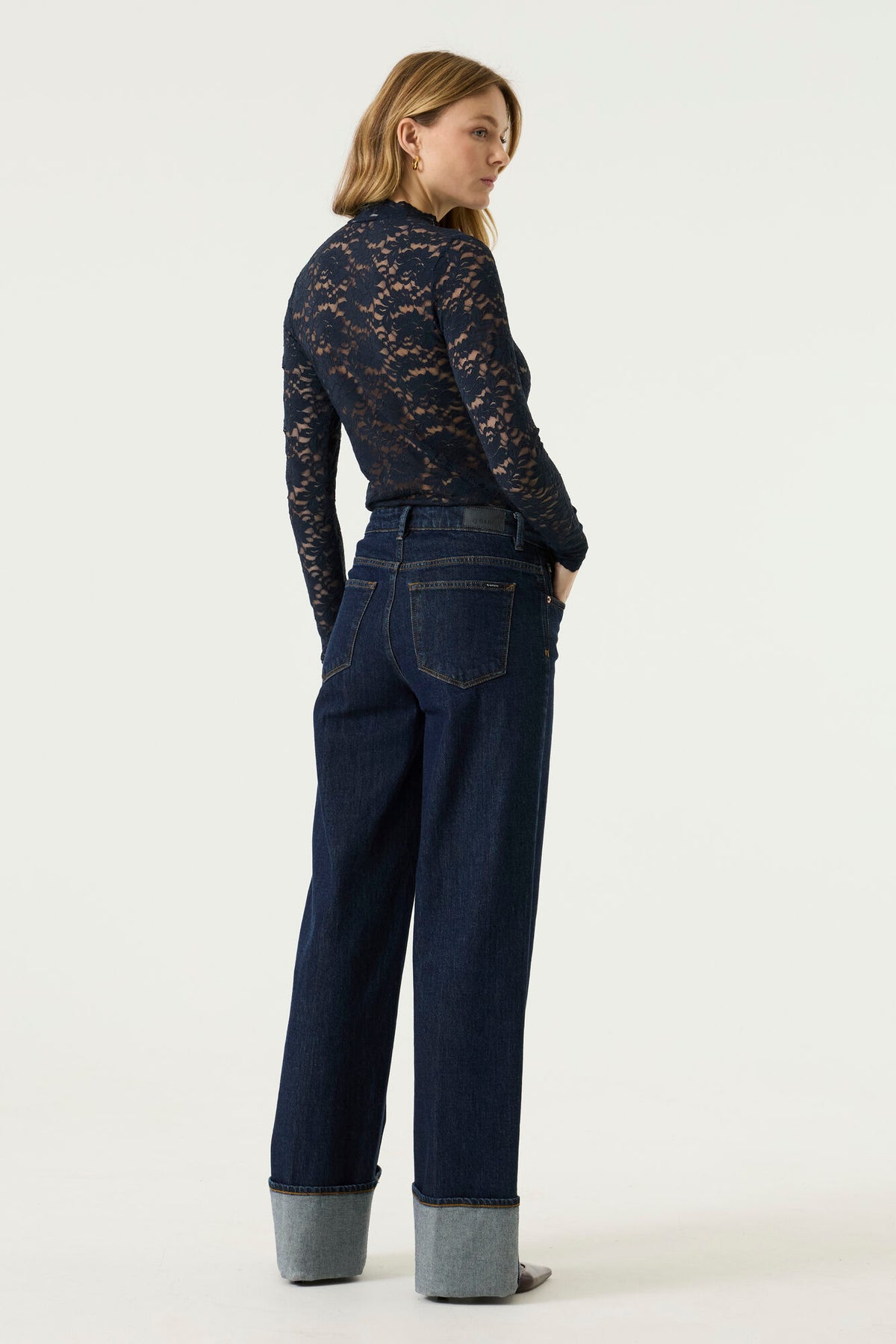 Garcia women's navy floral lace long sleeve blouse on model, back view showing sheer lace body and sleeves